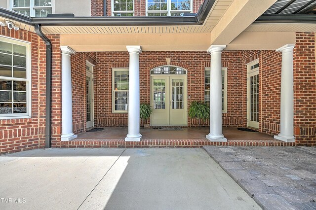 view of exterior entry featuring french doors