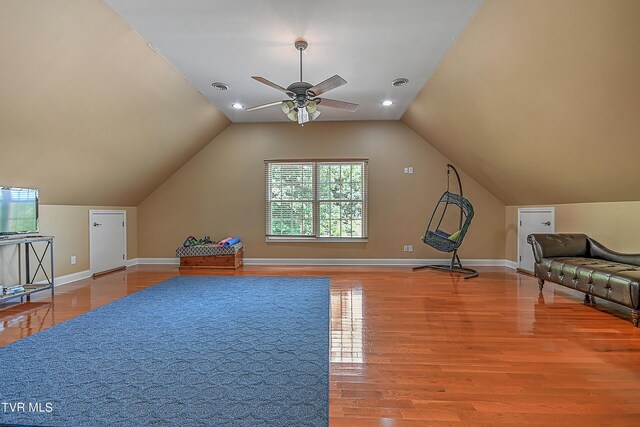 bonus room featuring wood-type flooring, lofted ceiling, and ceiling fan