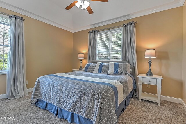 carpeted bedroom with crown molding and ceiling fan