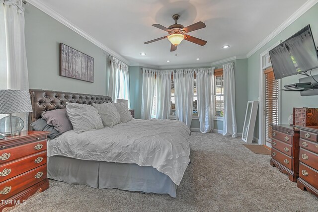 bedroom with crown molding, light colored carpet, and ceiling fan