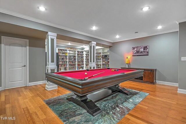 rec room with crown molding, wood-type flooring, pool table, and ornate columns