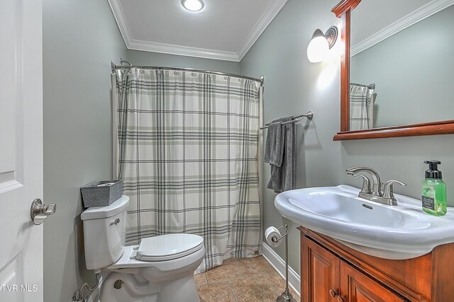 bathroom featuring vanity, crown molding, tile patterned floors, and toilet