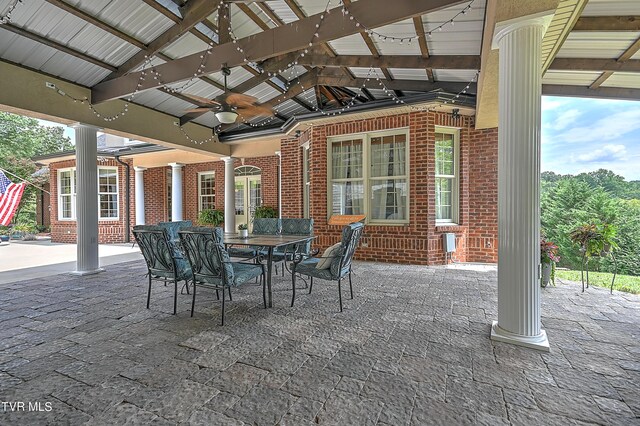 view of patio / terrace featuring a gazebo and ceiling fan