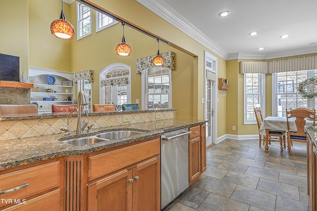 kitchen featuring sink, tasteful backsplash, decorative light fixtures, stainless steel dishwasher, and ornamental molding