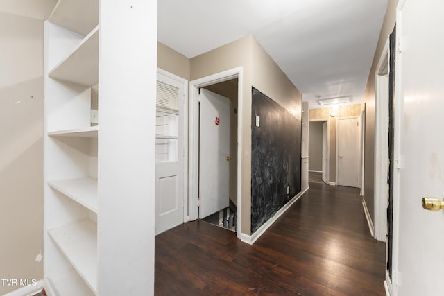 corridor featuring dark hardwood / wood-style flooring