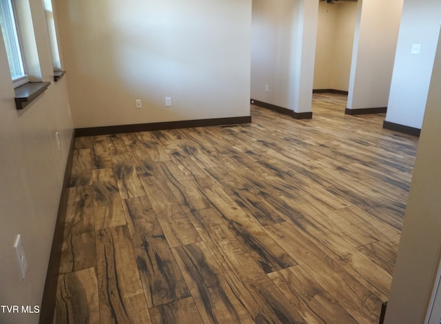 unfurnished room featuring wood-type flooring