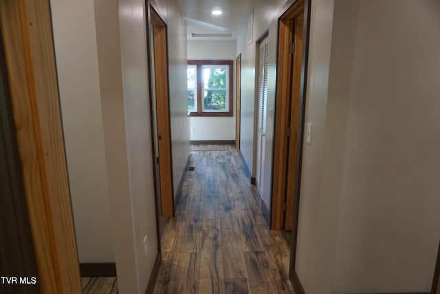 corridor featuring dark hardwood / wood-style floors