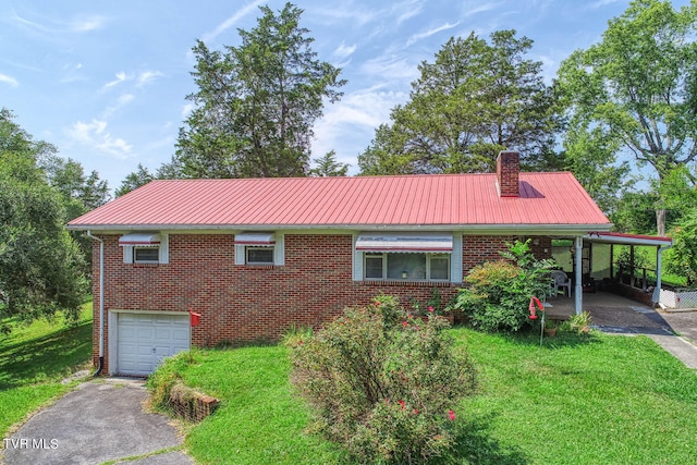 view of front facade with a garage, a front lawn, and a carport