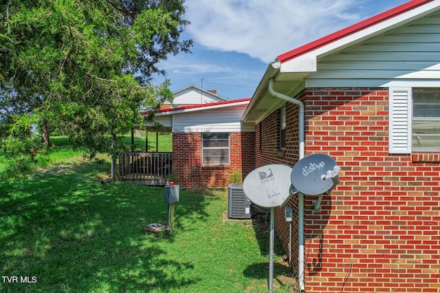 view of home's exterior with a yard