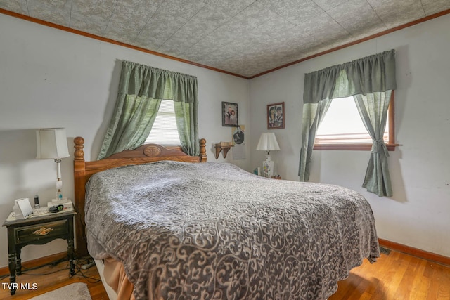 bedroom with hardwood / wood-style flooring