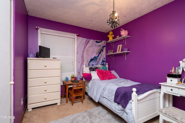 bedroom with light colored carpet and an inviting chandelier