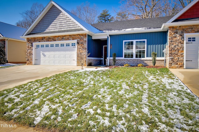 view of front of home with a yard and a garage