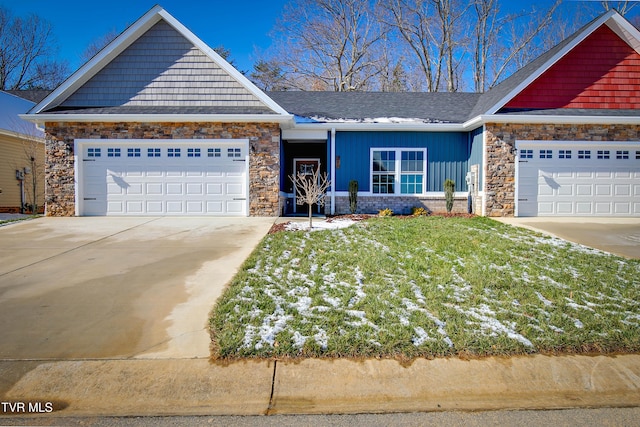 craftsman-style home featuring a garage and a front yard