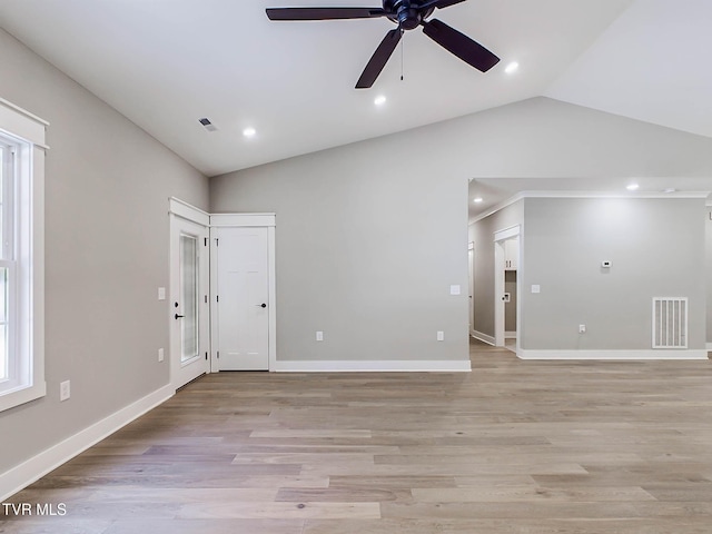 unfurnished room with ceiling fan, light wood-type flooring, and vaulted ceiling