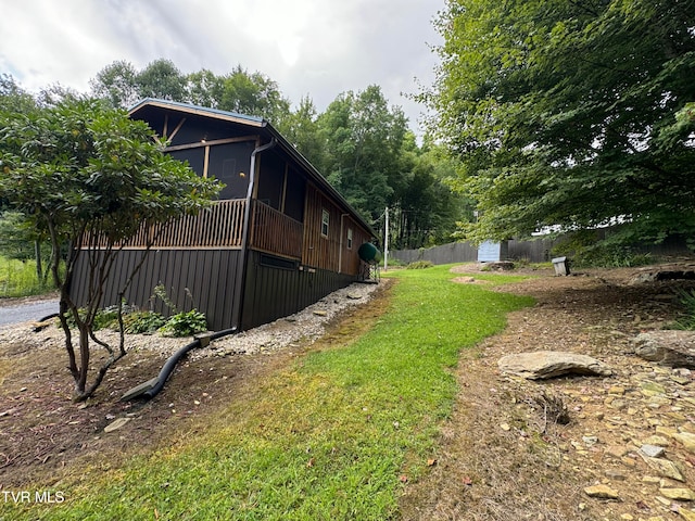 view of yard with a sunroom