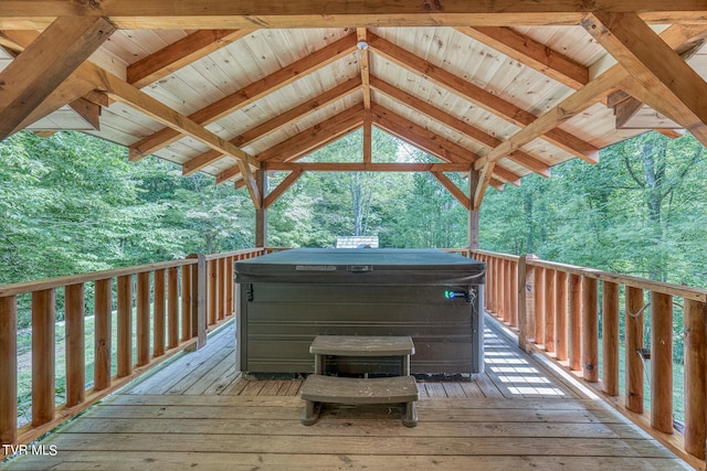 wooden deck featuring a gazebo and a hot tub