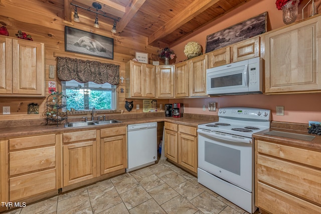 kitchen with white appliances, wooden ceiling, beam ceiling, wooden walls, and sink