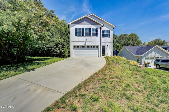 view of front of house featuring a front yard and a garage