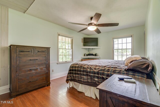 bedroom featuring ceiling fan and hardwood / wood-style flooring