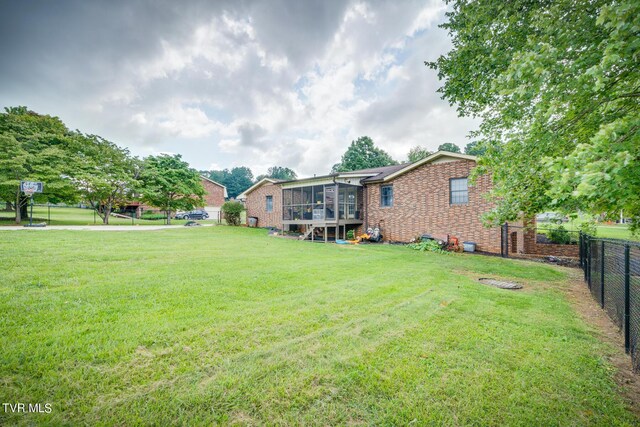 view of yard featuring a sunroom