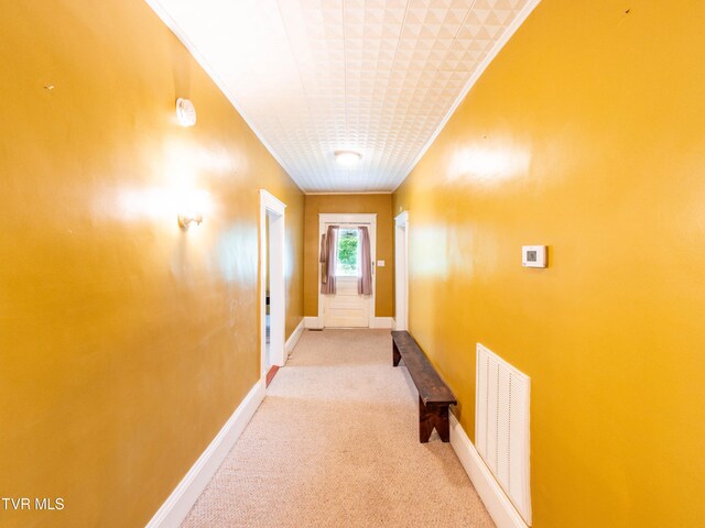 corridor with light colored carpet