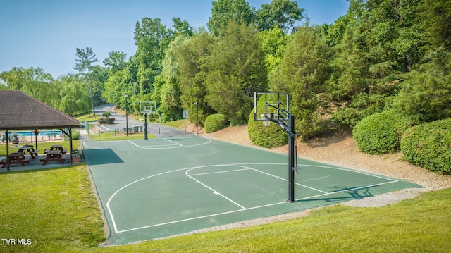 view of sport court with a gazebo and a lawn