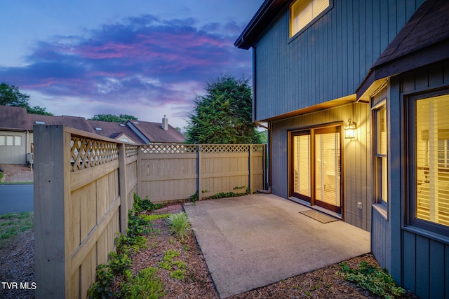 view of patio terrace at dusk