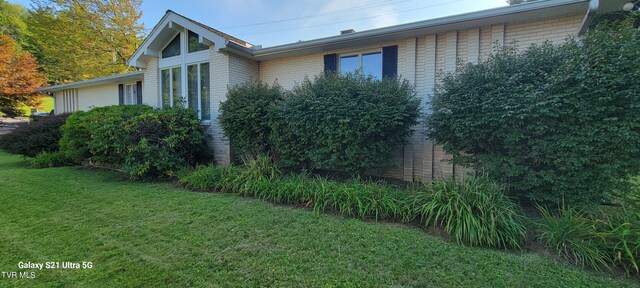 view of home's exterior featuring a yard