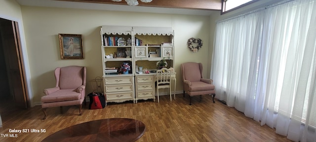 sitting room featuring wood finished floors