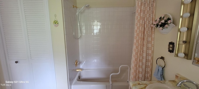 full bath featuring shower / tub combo, a closet, and a sink