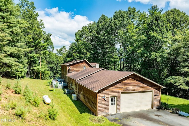 garage with aphalt driveway