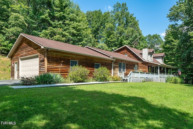 log home featuring a garage, a front lawn, a porch, and a shingled roof