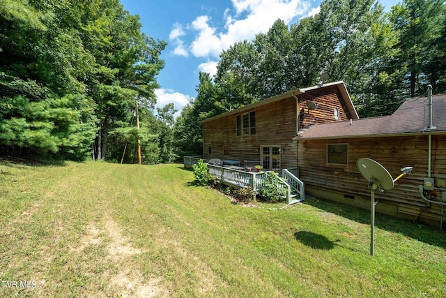 view of yard featuring a wooden deck