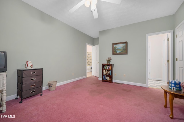 interior space featuring carpet flooring, a ceiling fan, and baseboards