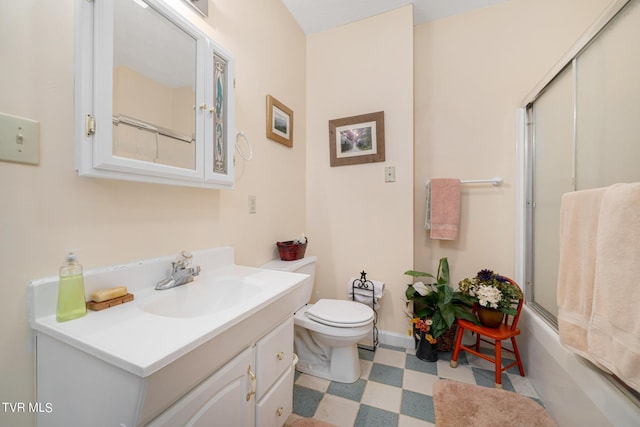 full bath with baseboards, vanity, toilet, and tile patterned floors