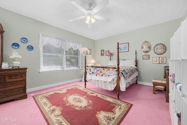 bedroom featuring a textured ceiling, ceiling fan, carpet flooring, and baseboards