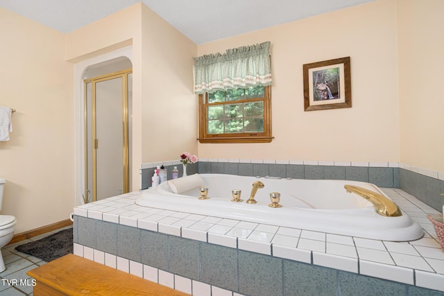 bathroom with a stall shower, baseboards, toilet, tile patterned flooring, and a bath