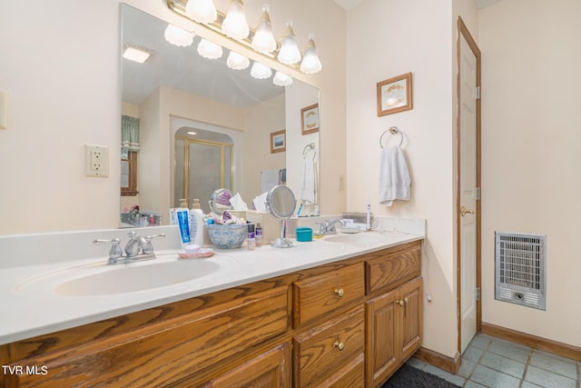 full bathroom featuring double vanity, tile patterned flooring, a sink, and heating unit