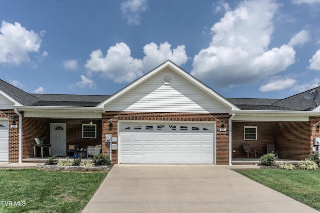 ranch-style home featuring a garage, covered porch, concrete driveway, and brick siding