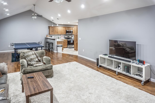 living room with recessed lighting, a ceiling fan, baseboards, vaulted ceiling, and dark wood-style floors