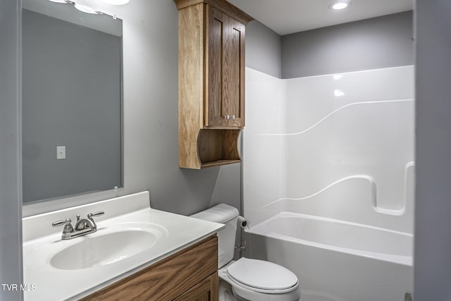 full bathroom with  shower combination, toilet, and vanity