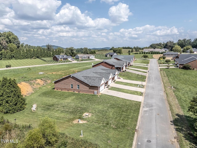 birds eye view of property with a rural view