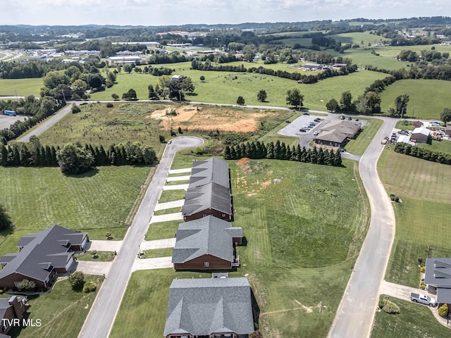 birds eye view of property featuring a rural view