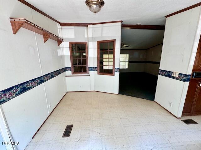 kitchen with ceiling fan and light tile patterned flooring