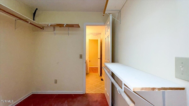 spacious closet with tile patterned flooring