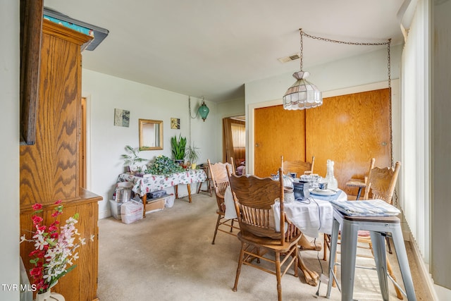 view of carpeted dining space