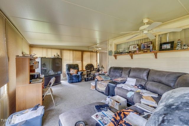 carpeted living room with ceiling fan