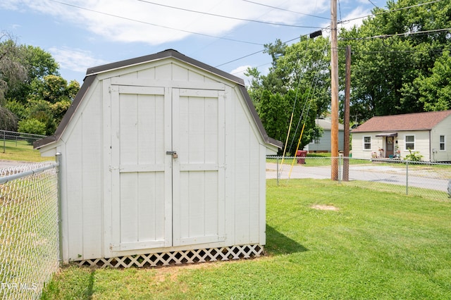 view of outbuilding with a yard