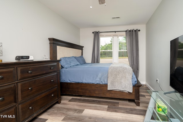 bedroom with light wood-type flooring