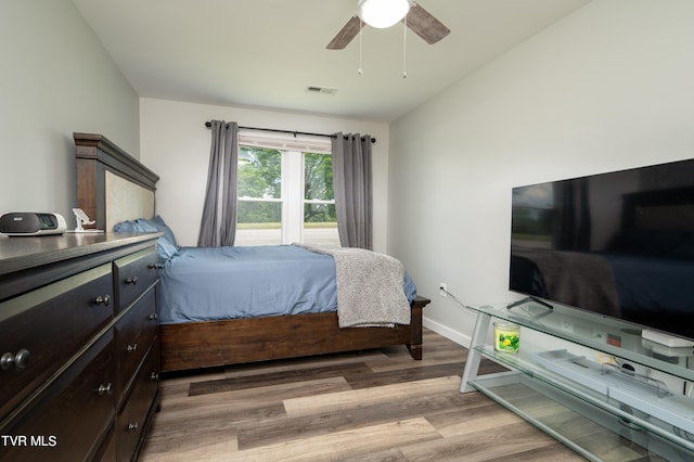 bedroom featuring lofted ceiling, ceiling fan, and light hardwood / wood-style floors